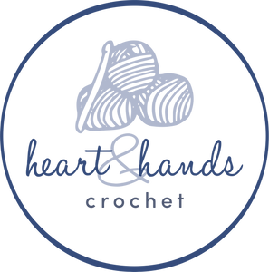 Blue circle containing Heart and Hands Crochet logo which includes three balls of yarn and a crochet hook